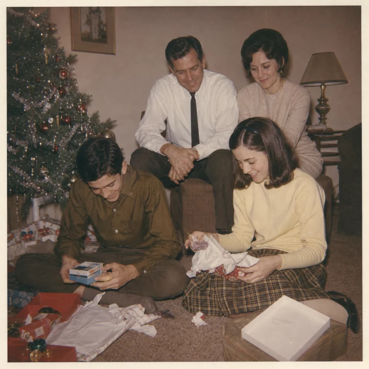 Arthur and Evelyn watching James and Marian open presents on Christmas morning in 1966.
